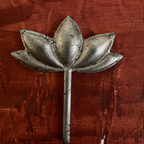 Close-up of one Kamal lotus-shaped wooden wall decoration