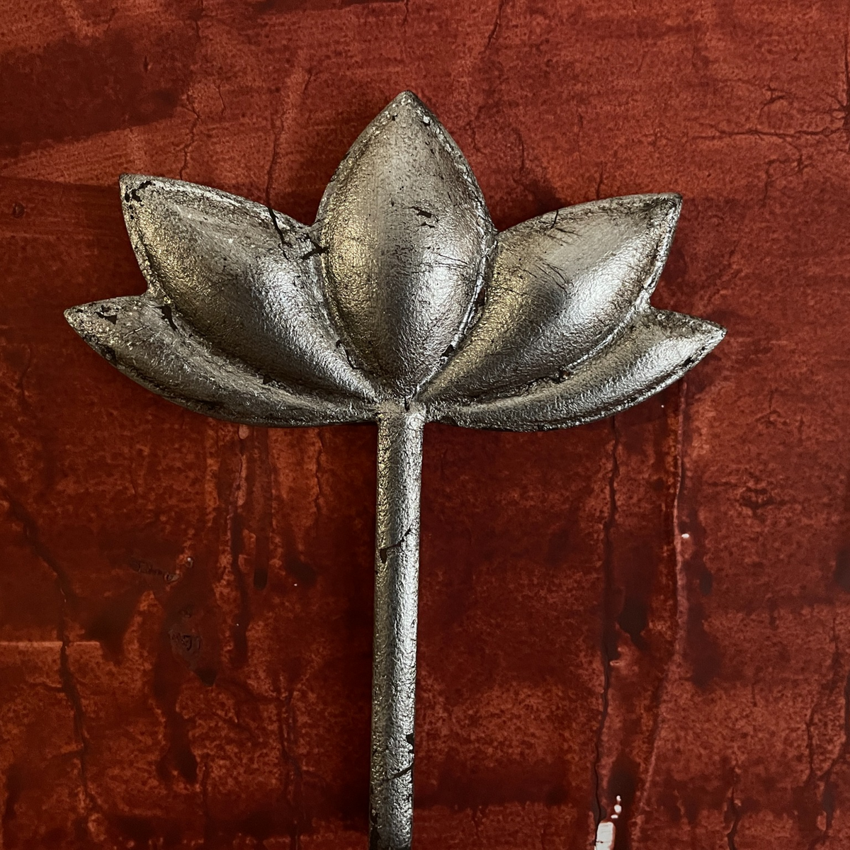 Close-up of one Kamal lotus-shaped wooden wall decoration