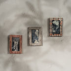Set of three wooden magnetic Instax Mini photo frames in red and neutral patterns