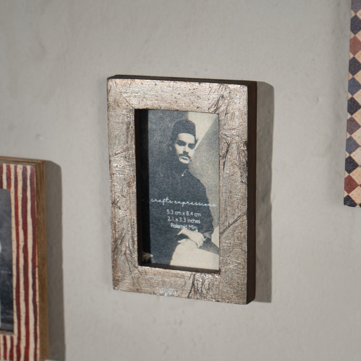 Set of three wooden magnetic Instax Mini photo frames in red and neutral patterns