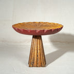Antique gold and red wooden cake stand with flower-shaped top and tall pedestal