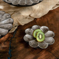 Set of three warm-silver foil flower-shaped wooden serving platters in graduated sizes