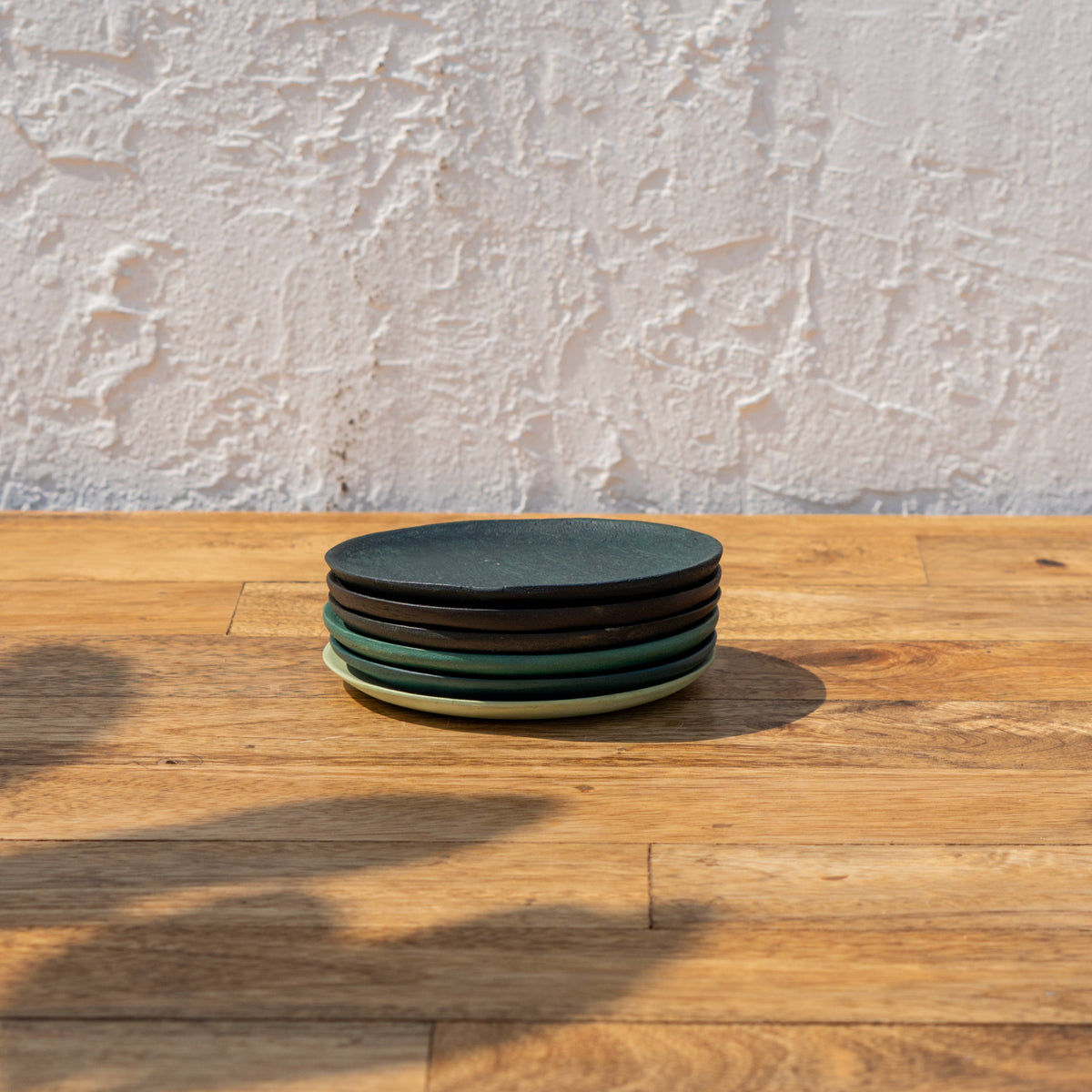 Stack of Monsoon wooden coasters