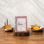 Earthy pink Mother of Pearl photo frame styled vertically on a table