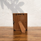 Back view of the olive-tone Mother of Pearl photo frame with easel stand and wall fittings
