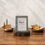 Olive-tone Mother of Pearl photo frame styled vertically on a table