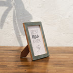 Angled side view of the olive-tone Mother of Pearl photo frame