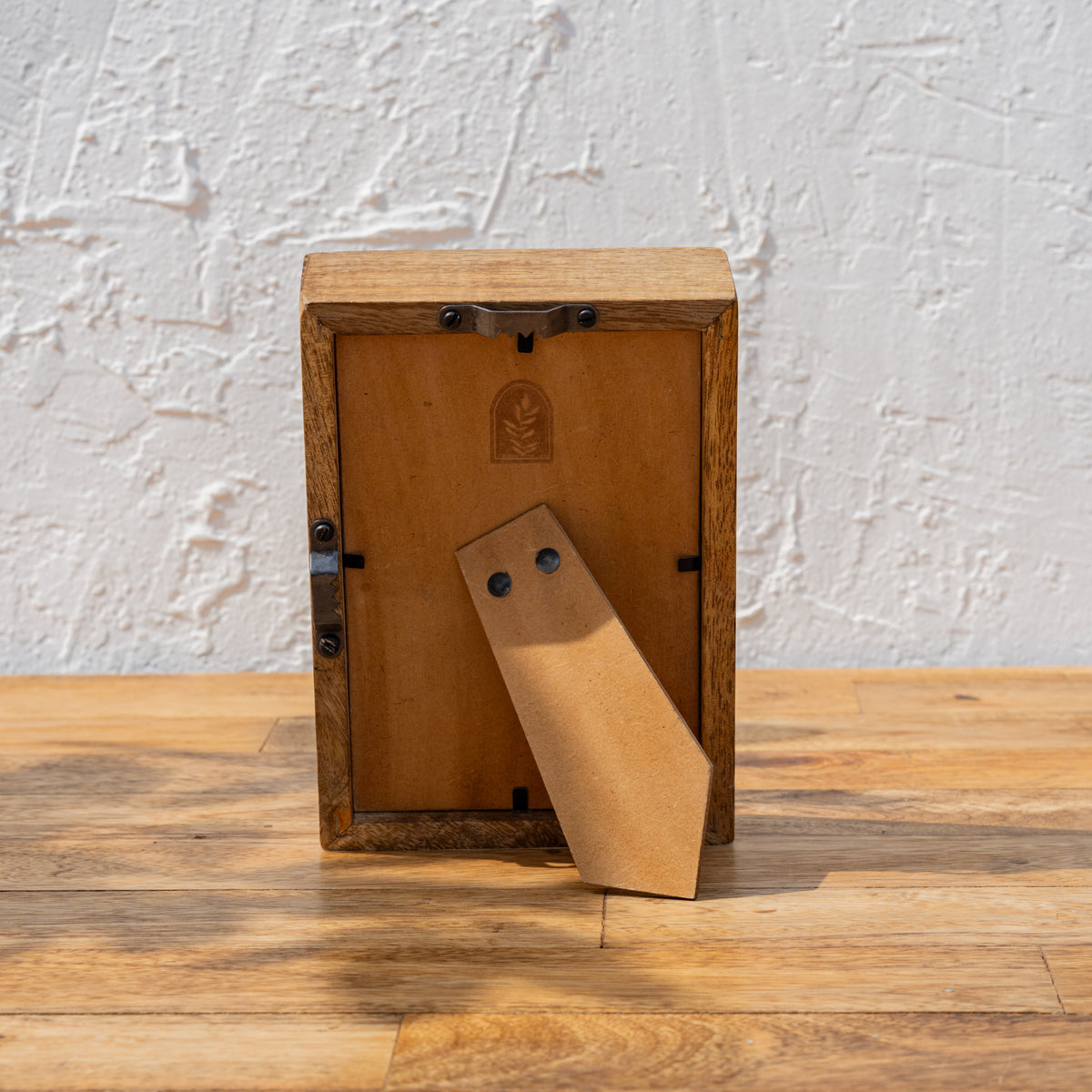 Back view of the Niche small wooden photo frame with easel stand and wall hook