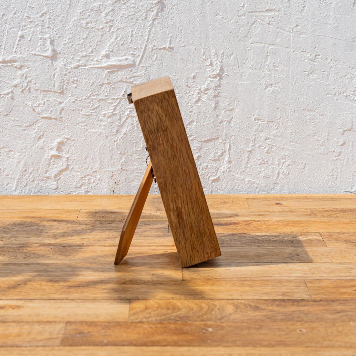 Side view of the Niche small wooden photo frame with easel stand
