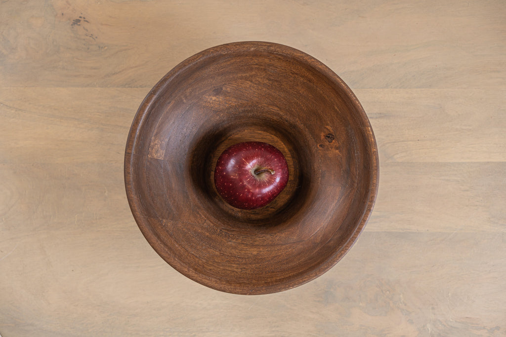 Top view of the Oro wooden serving bowl with an apple