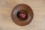 Top view of the Oro wooden serving bowl with an apple