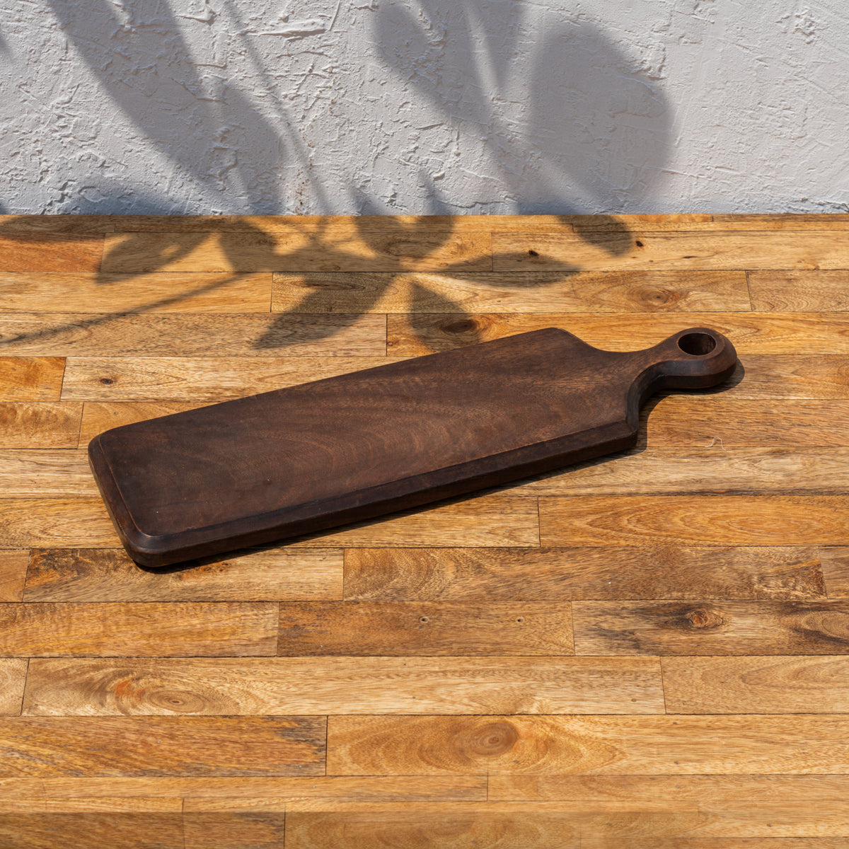 Angled view of the Paddle wooden cheese board
