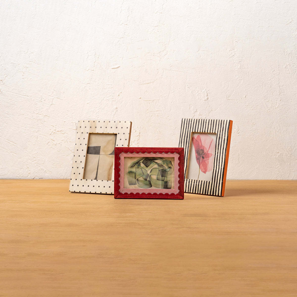 Polka Dot photo frame displayed with three other frames