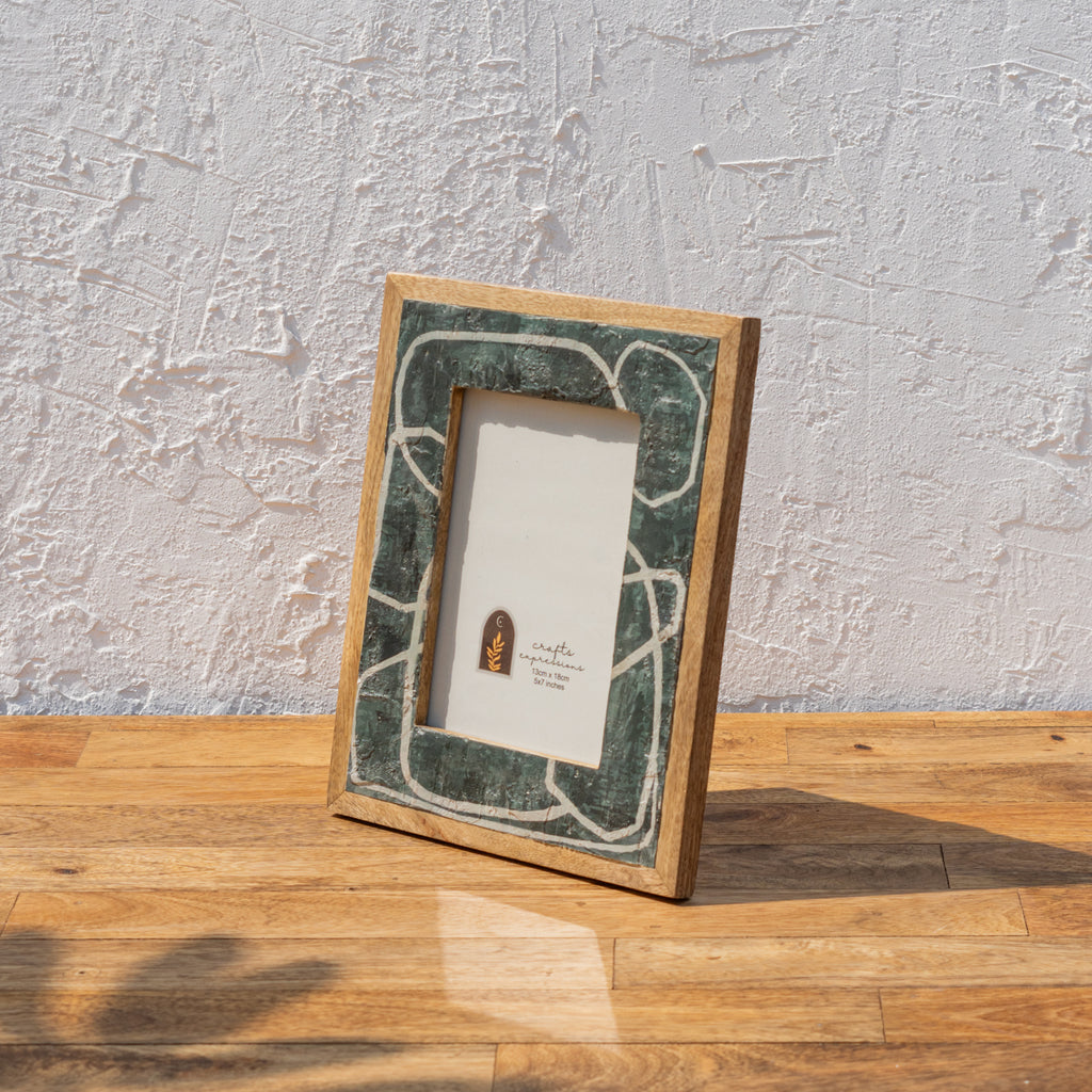 Angled view of the green abstract Pollok wooden photo frame