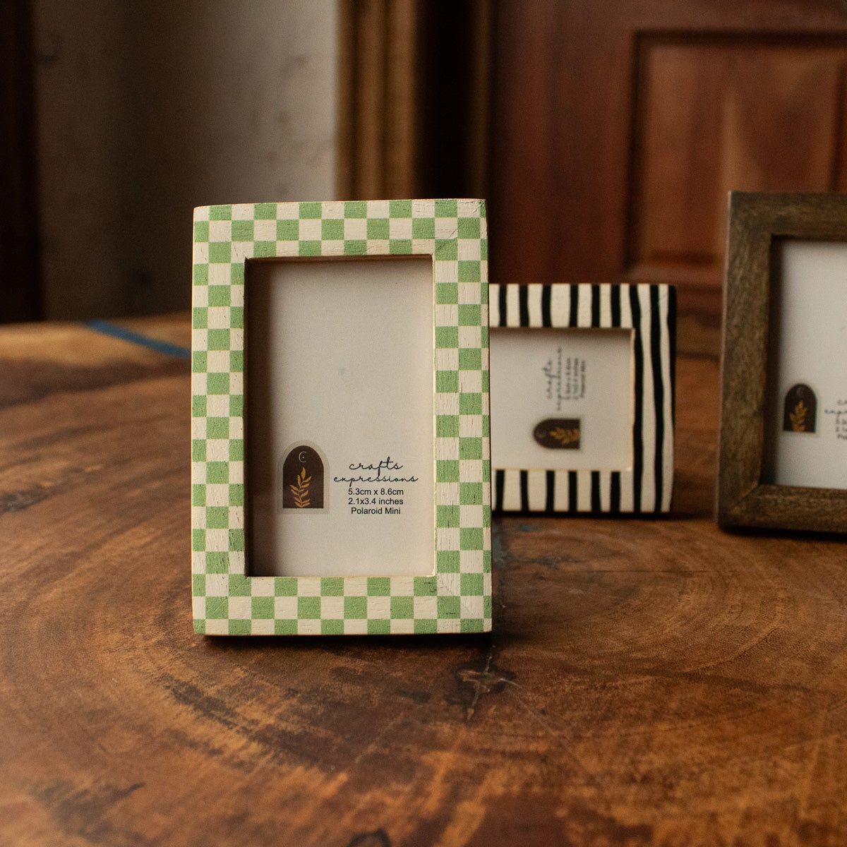 Green checkerboard wooden Polaroid photo frame from the set of three