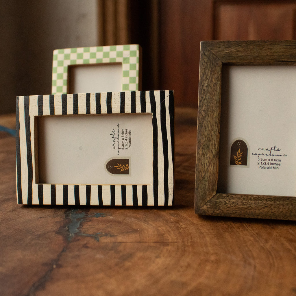 Striped and natural wood Polaroid photo frames from the set of three