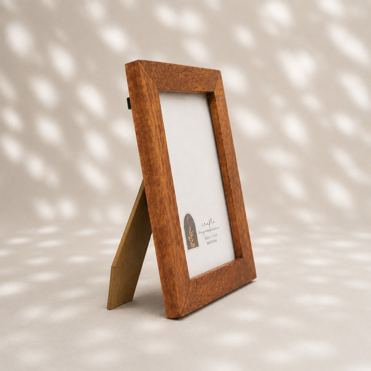 Textured earthy-brown wooden photo frame for a 4 by 6 inch photograph