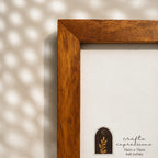 Textured earthy-brown wooden photo frame for a 4 by 6 inch photograph