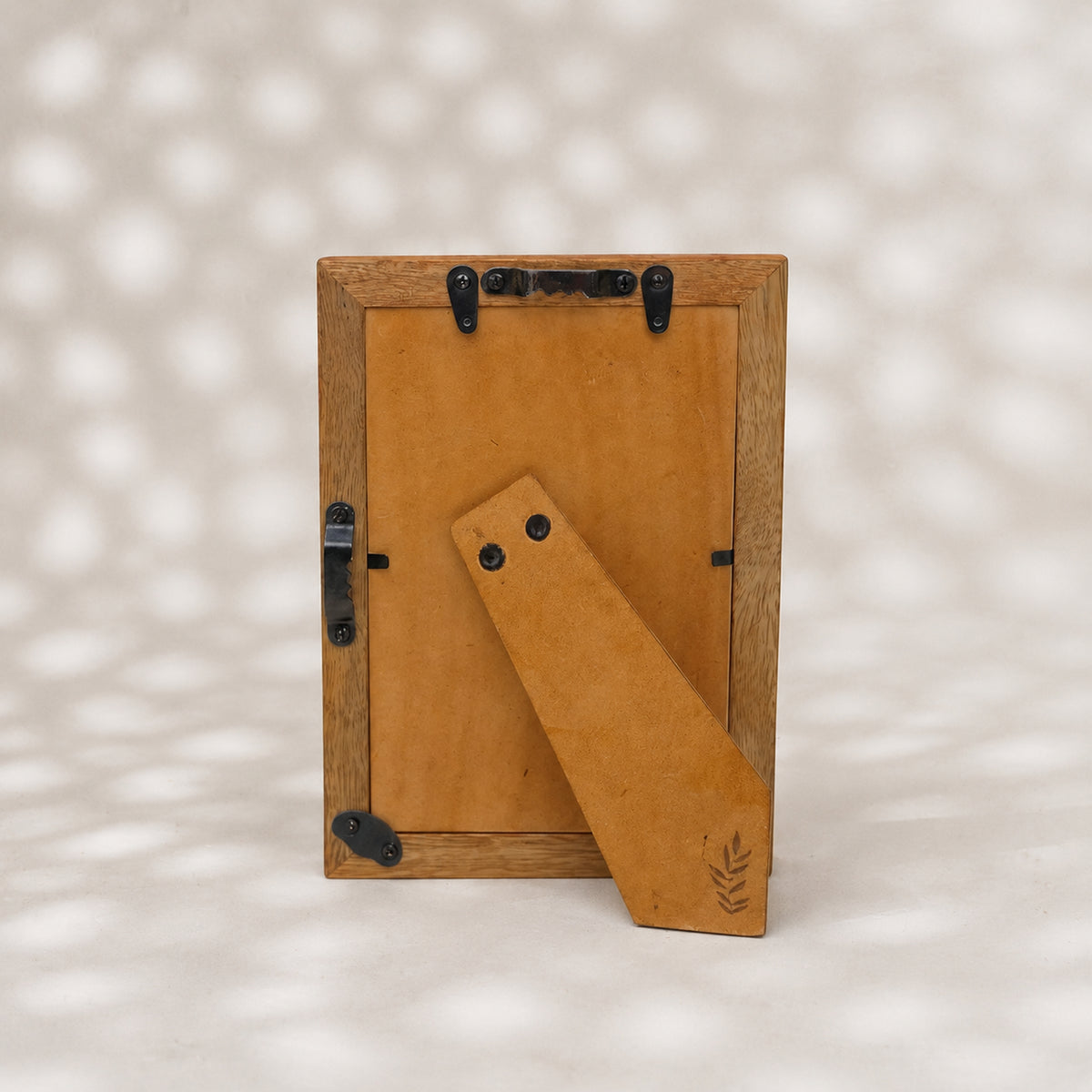 Textured earthy-brown wooden photo frame for a 4 by 6 inch photograph