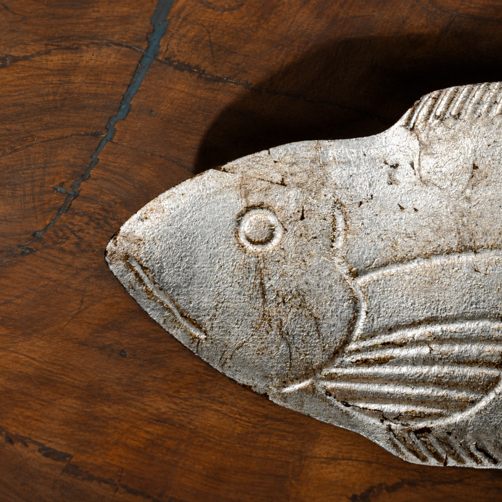 Close-up of the carved fish detail on a Matsya wooden serving platter