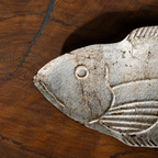 Close-up of the carved fish detail on a Matsya wooden serving platter