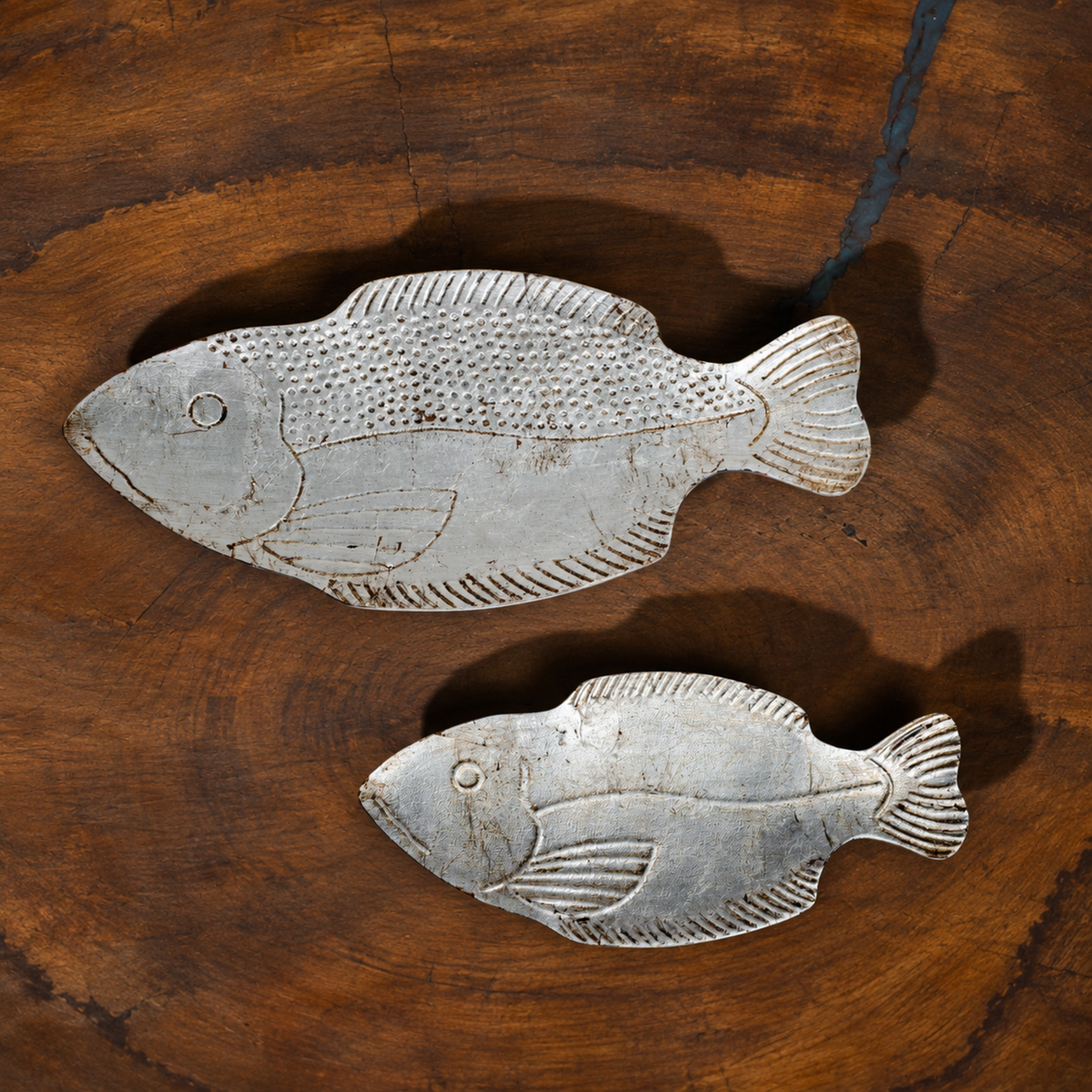 Top view of the two Matsya fish-shaped wooden serving platters