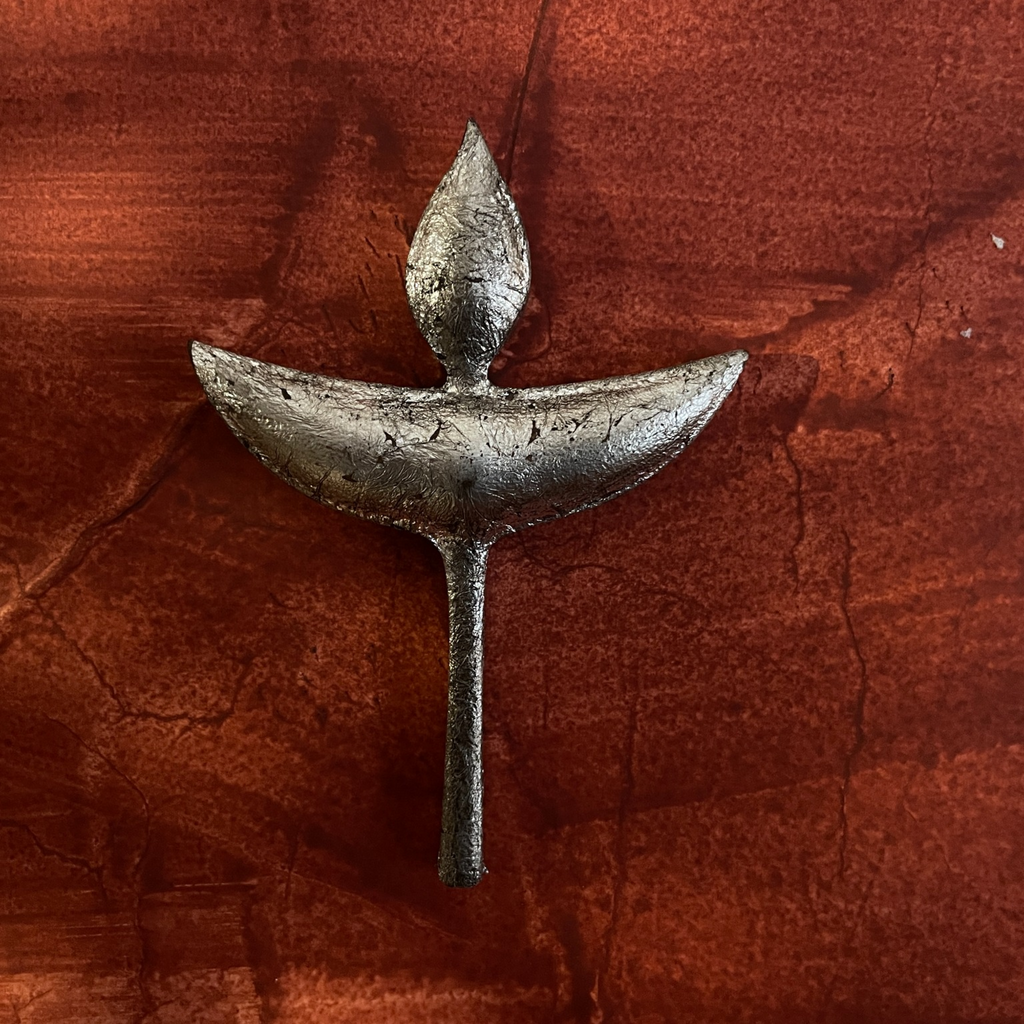 Close-up of one Nuri diya-shaped wooden wall decoration
