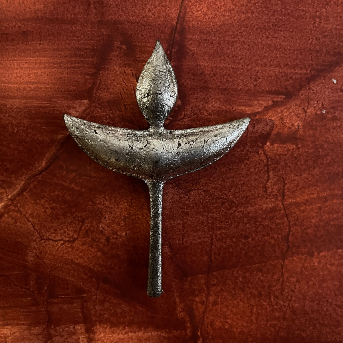 Close-up of one Nuri diya-shaped wooden wall decoration
