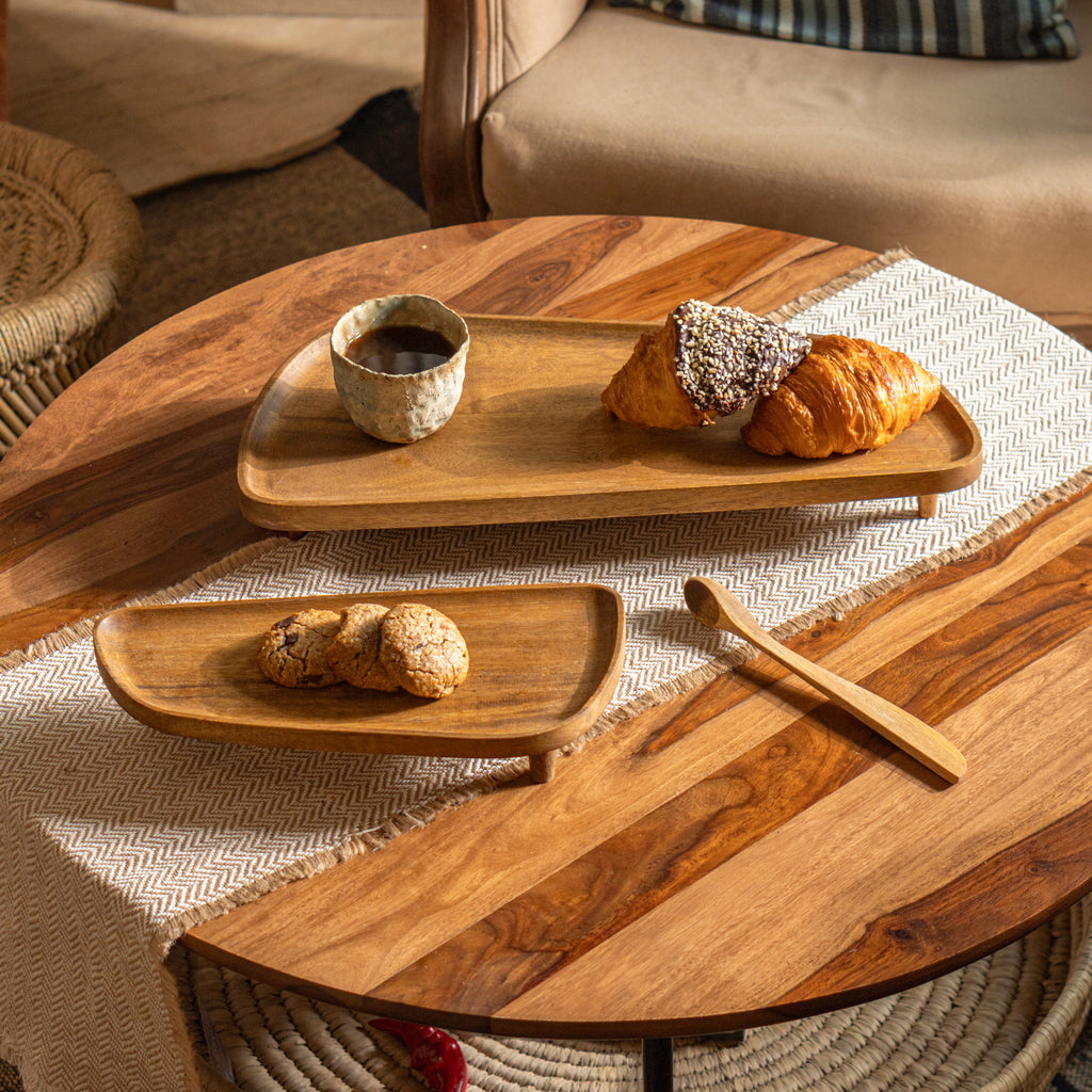 Two Spaceship wooden riser stands styled with baked goods and a cup