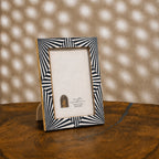 Black and white starburst wooden photo frame for a 4 by 6 inch photograph