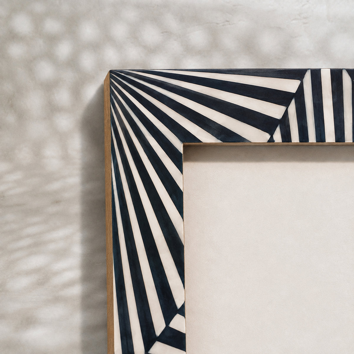Black and white starburst wooden photo frame for a 4 by 6 inch photograph