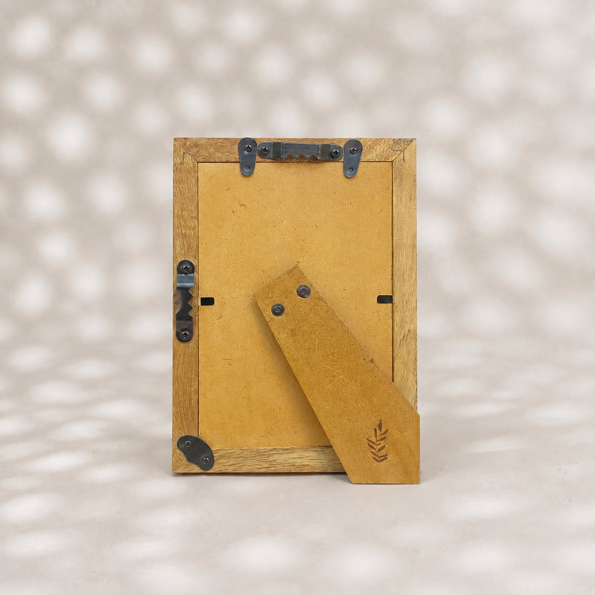Black and white starburst wooden photo frame for a 4 by 6 inch photograph