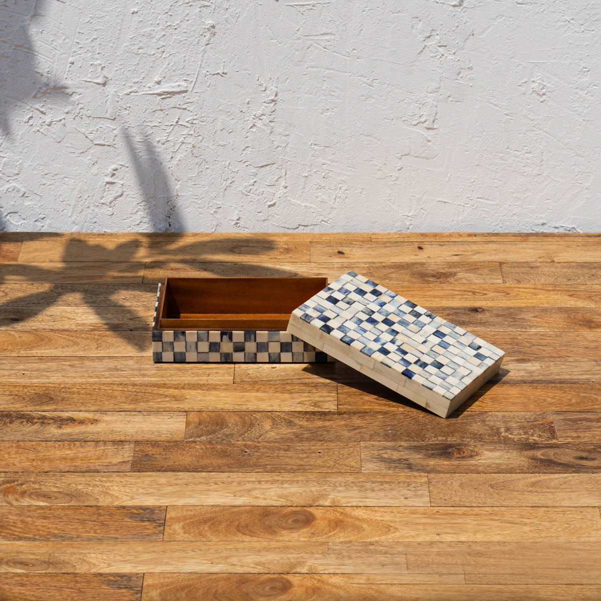 Open Checker wooden storage box with patterned lid beside it