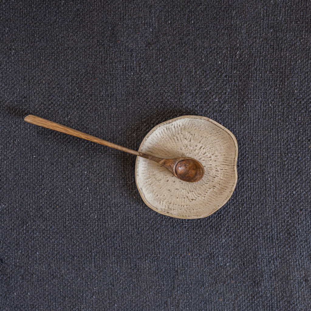 Top view of a Drift trinket tray with a small spoon
