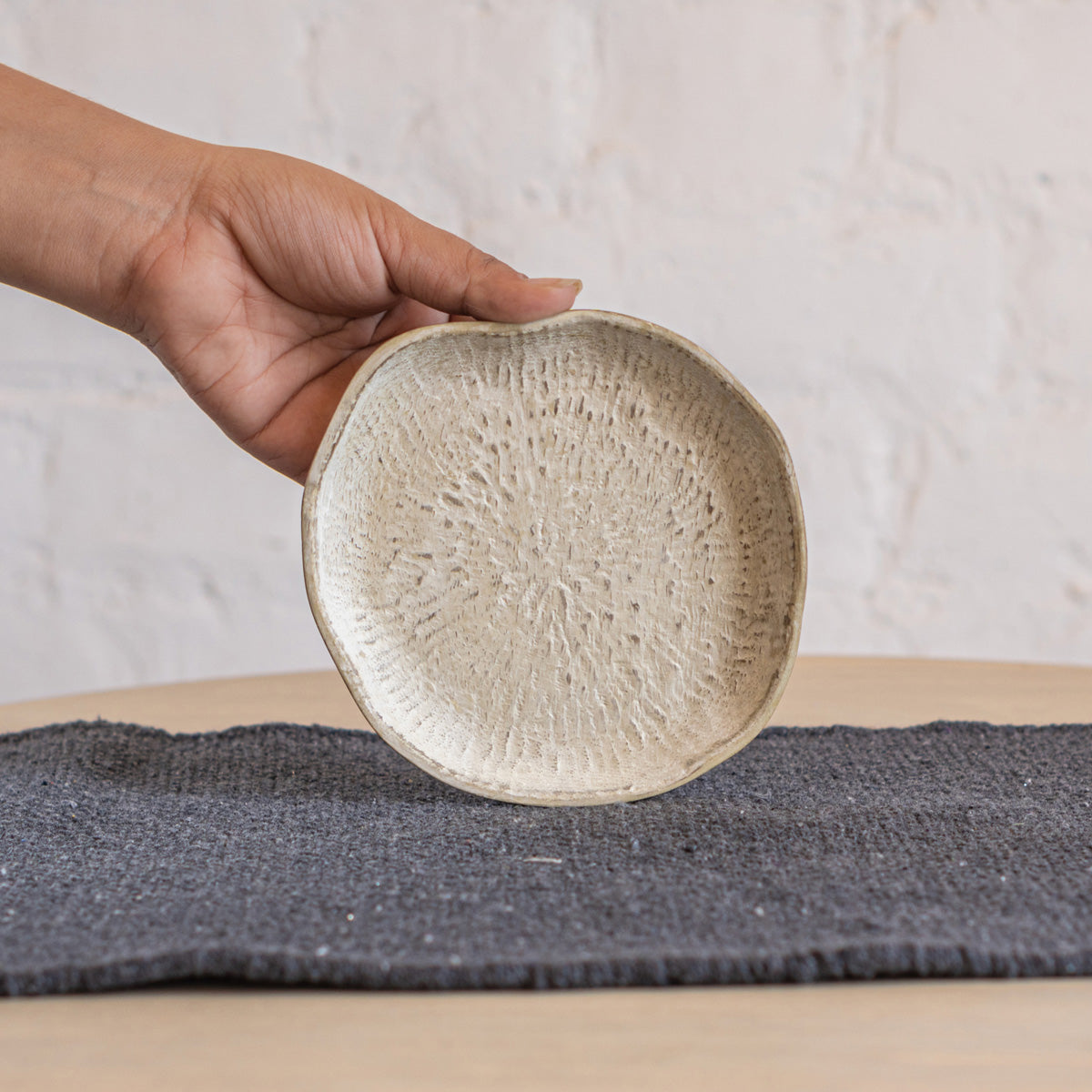 Drift trinket tray held in one hand