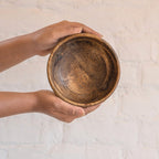 Ellipse wooden nut bowl held in both hands