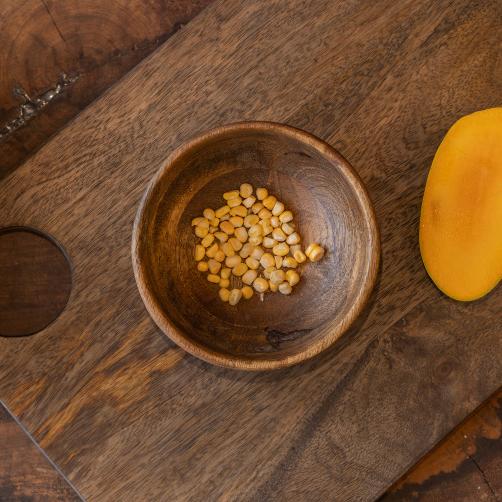 Ellipse wooden nut bowl styled with small snacks