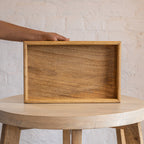 Essence wooden serving tray held upright