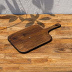Glide wooden chopping and serving board shown at an angle