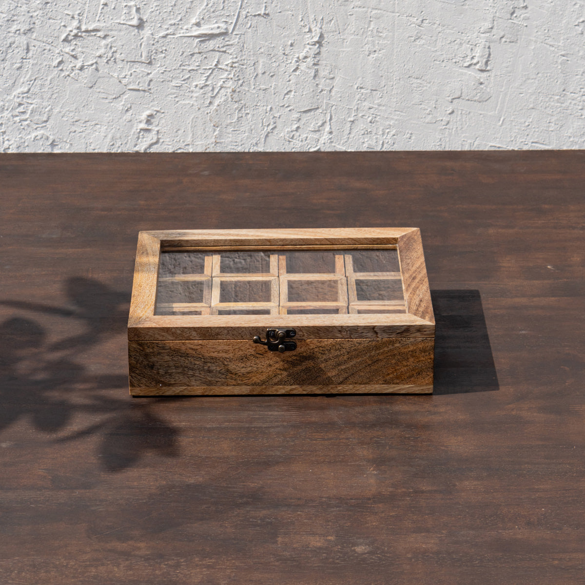 Closed Khazana wooden masala box with glass lid and nine compartments visible