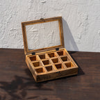 Khazana wooden masala box with its glass lid open to reveal nine compartments