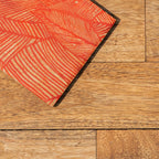 Close-up of the orange pattern on a Palash printed coaster
