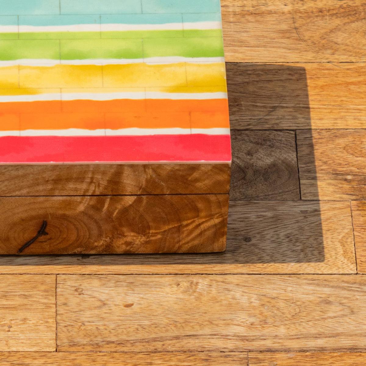 Close-up of the striped lid of the Pride wooden storage box