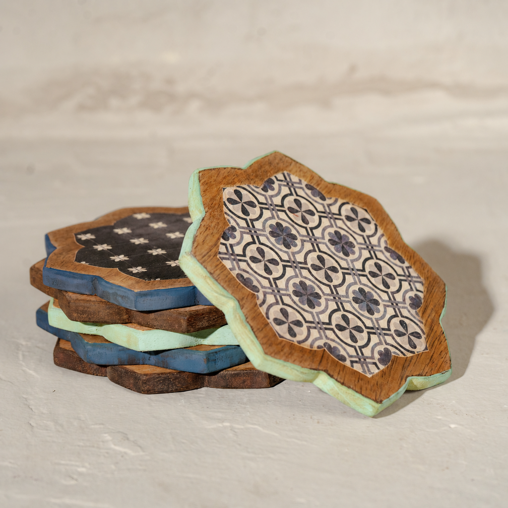 Stacked Kasida wooden coasters showing varied blue patterns