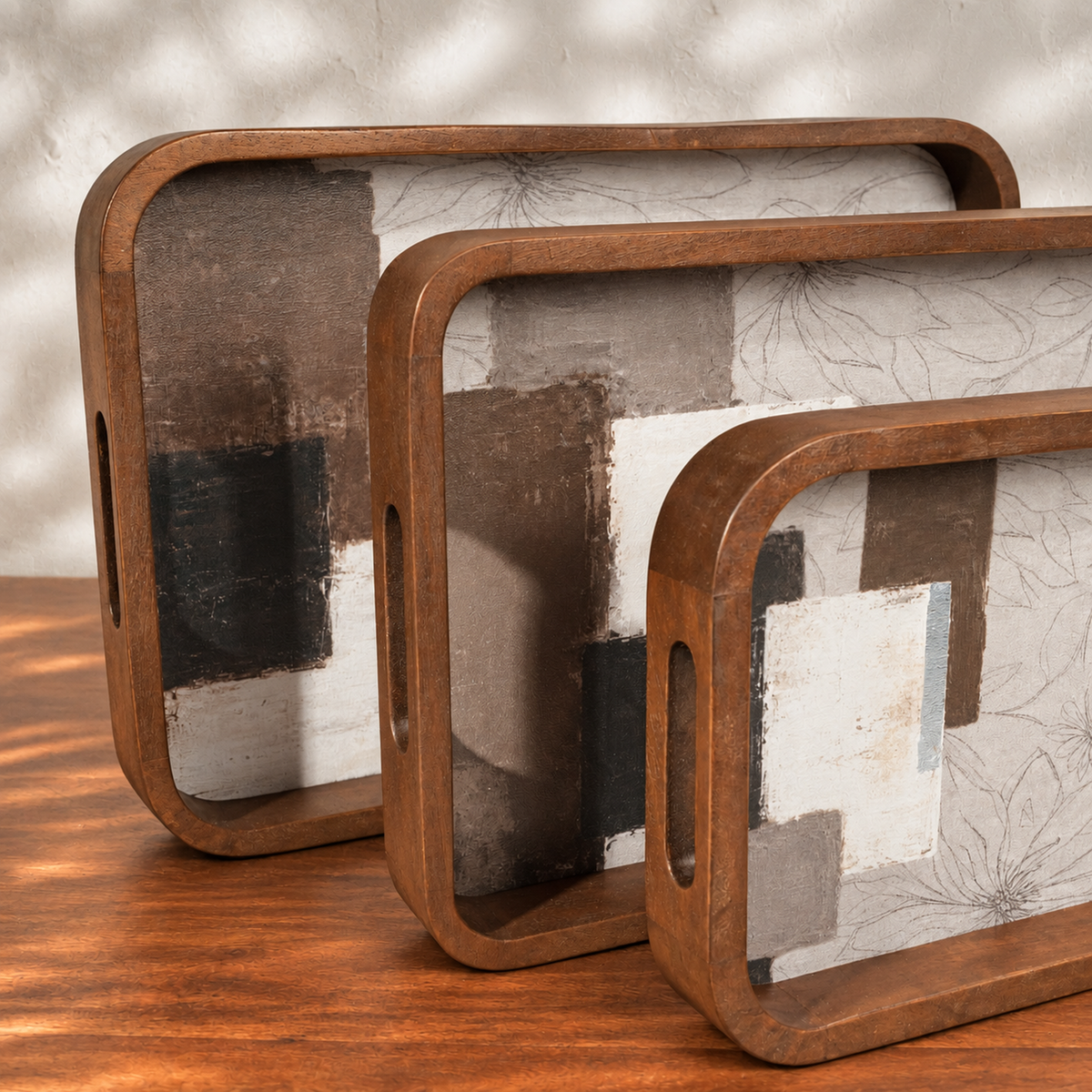 Three Mehfil wooden serving trays displayed upright by size
