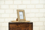 Small Trunk photo frame styled on a wooden block