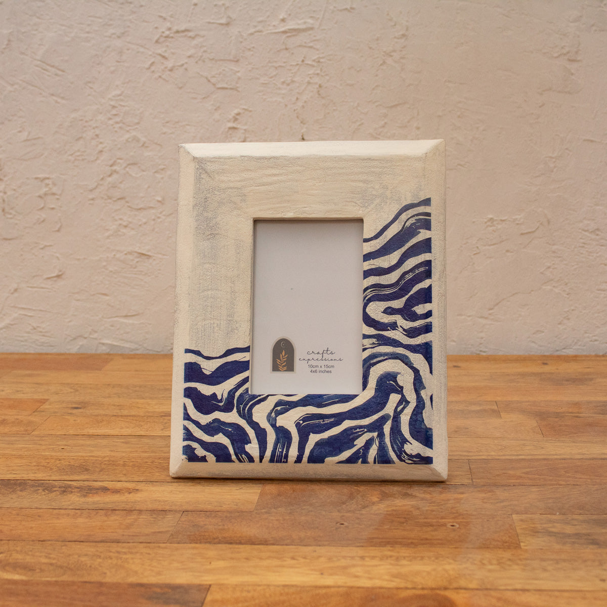 Front view of the white and blue Waves wooden photo frame displayed vertically