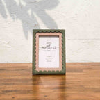 Front view of the olive and pink wavy wooden photo frame