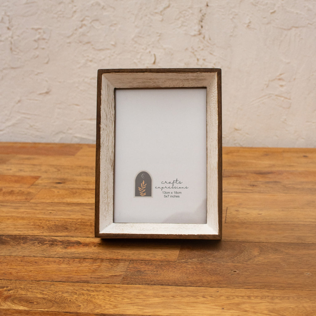 Niche natural wood and white photo frame displayed vertically