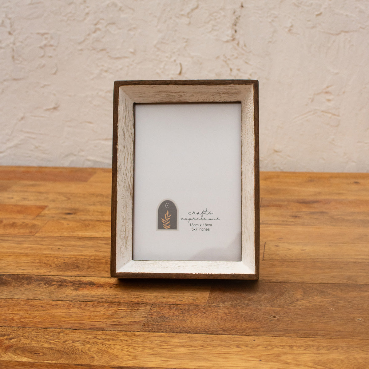 Niche natural wood and white photo frame displayed vertically
